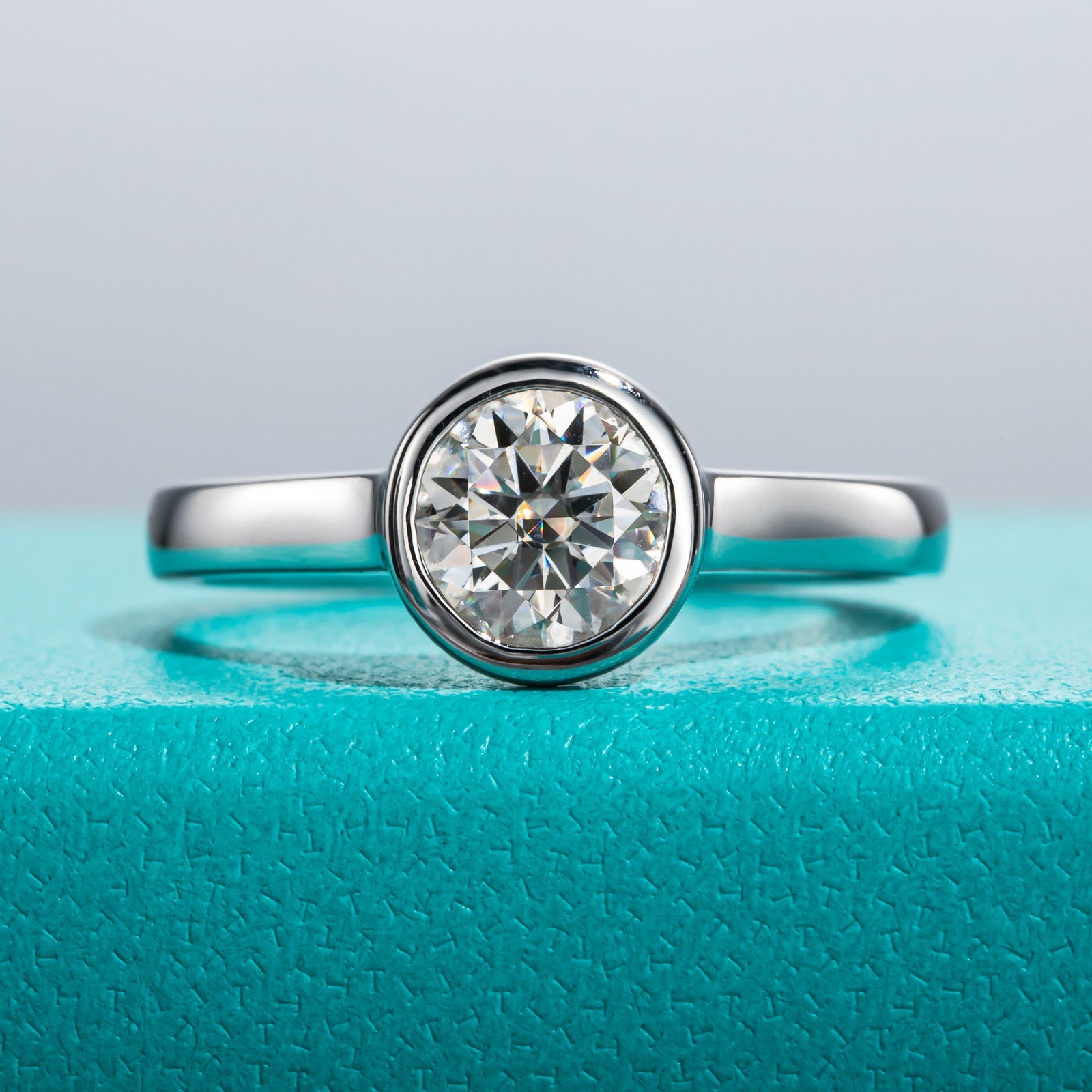Round Cut Bezel Moissanite Engagement Ring (1 ct)